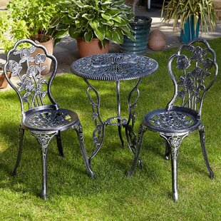 Wrought iron table on sale and 2 chairs